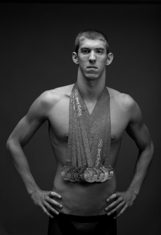 Michael Phelps of the United States poses with his eight gold medals all won in The swimming competition during the Beijing 2008 Olympic Games on August 18, 2008 in Beijing, China.