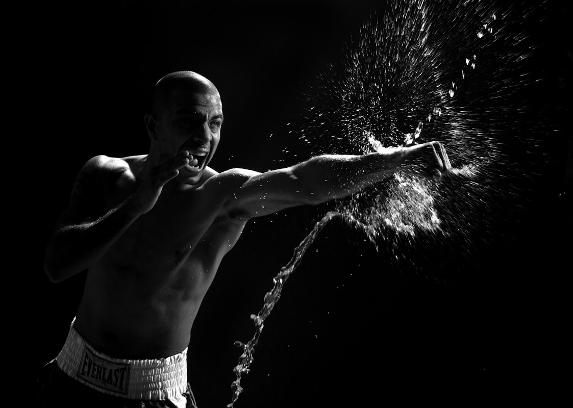 Featherweight contender Gary {quote}Kid{quote} Stark Jr. punches at a stream of water at the Church Street Gym on November 16, 2007 in New York, New York. 