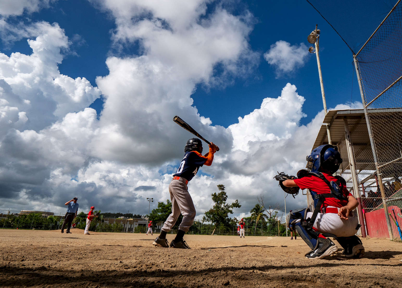 CAYEY, PUERTO RICO - NOVEMBER 10: Players compete in a Little League baseball game on November 10, 2018 in Cayey, Puerto Rico. The effort continues in Puerto Rico to remain and rebuild more than one year after the Hurricane Maria hit and devastated the island on September 20, 2017. The official number of deaths from the disaster is 2,975. 