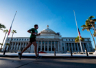 OLD SAN JUAN, PUERTO RICO - NOVEMBER 11:  An athlete competing in a 5k race runs past the Capitol Bulding on November 11, 2018 in Old San Juan, Puerto Rico. The effort continues in Puerto Rico to remain and rebuild more than one year after the Hurricane Maria hit and devastated the island on September 20, 2017. The official number of deaths from the disaster is 2,975. 