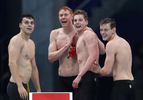 (L-R) James Guy, Tom Dean, Duncan Scott and Matthew Richards of Team Great Britain celebrate after winning the gold medal in the Men's 4 x 200m Freestyle Relay Final on day five of the Tokyo 2020 Olympic Games at Tokyo Aquatics Centre on July 28, 2021 in Tokyo, Japan. 