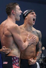 Ryan Murphy (L) and Caeleb Dressel of Team United States react after winning the gold medal and breaking the world record in the Men's 4 x 100m Medley Relay Final on day nine of the Tokyo 2020 Olympic Games at Tokyo Aquatics Centre on August 01, 2021 in Tokyo, Japan. 