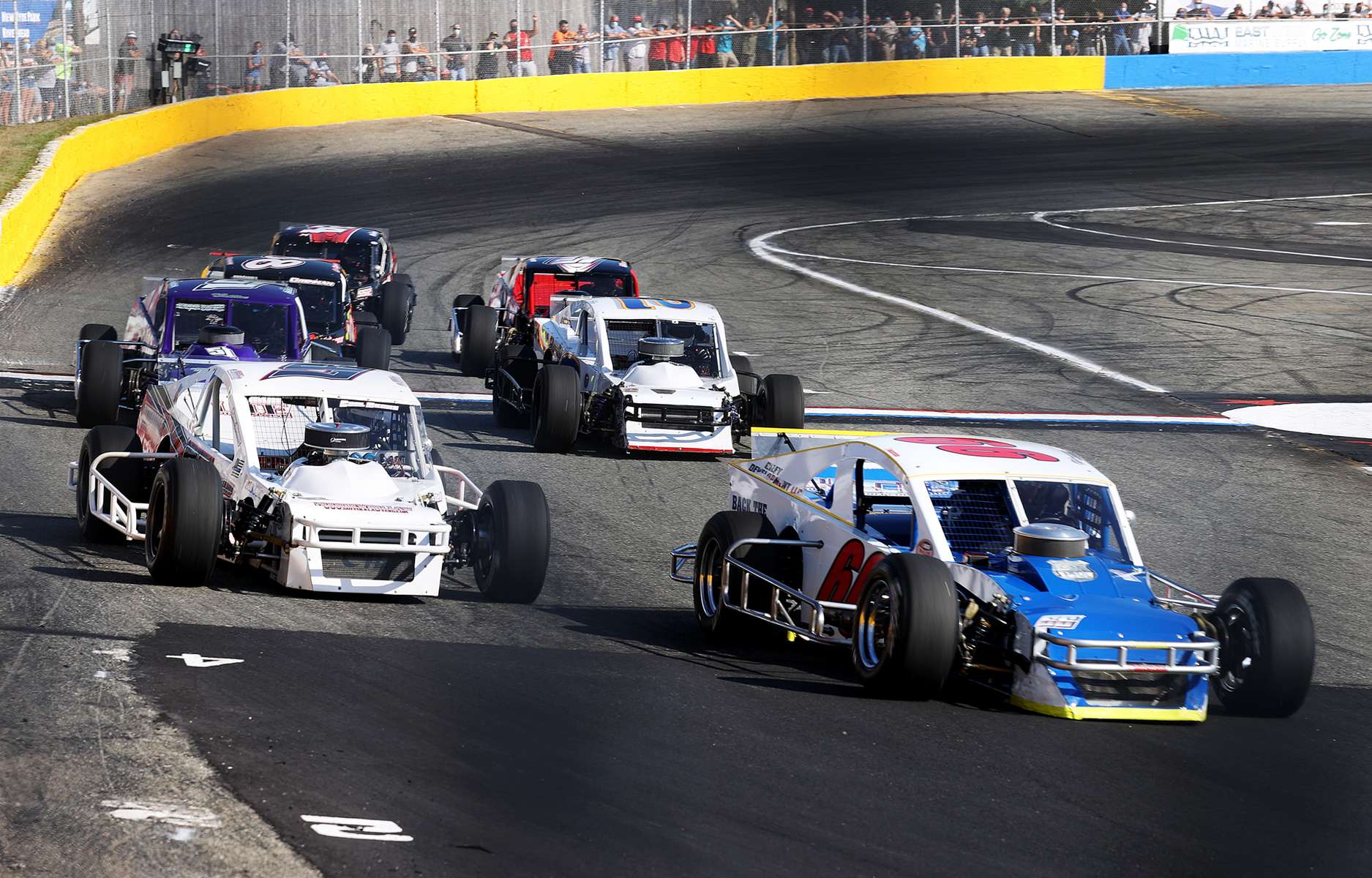 Cars race around the track during NASCAR Advance Auto Series Opening Night at Riverhead Raceway on August 01, 2020 in Riverhead, New York.  The race track had been closed due to the coronavirus COVID-19 pandemic.  More than 4,585,258 people in the United States alone have been infected with the coronavirus and at least 154,000 have died.  