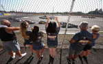 Fans watch cars racing around the track during NASCAR Advance Auto Series Opening Night at Riverhead Raceway on August 01, 2020 in Riverhead, New York.  The race track had been closed due to the coronavirus COVID-19 pandemic.  More than 4,585,258 people in the United States alone have been infected with the coronavirus and at least 154,000 have died.  