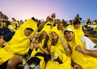 Fans cheer as the The Savannah Bananas play their home opener against the Party Animals at Grayson Stadium on February 25, 2023 in Savannah, Georgia.  