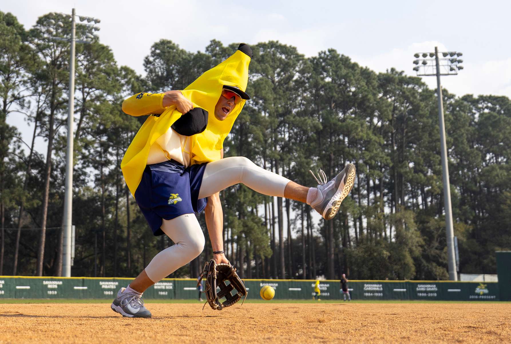 Jackson Olson #8 of the Savannah Bananas fields ground balls in a Banana Skin suit prior to their home opener against the Party Animals at Grayson Stadium on February 25, 2023 in Savannah, Georgia.   