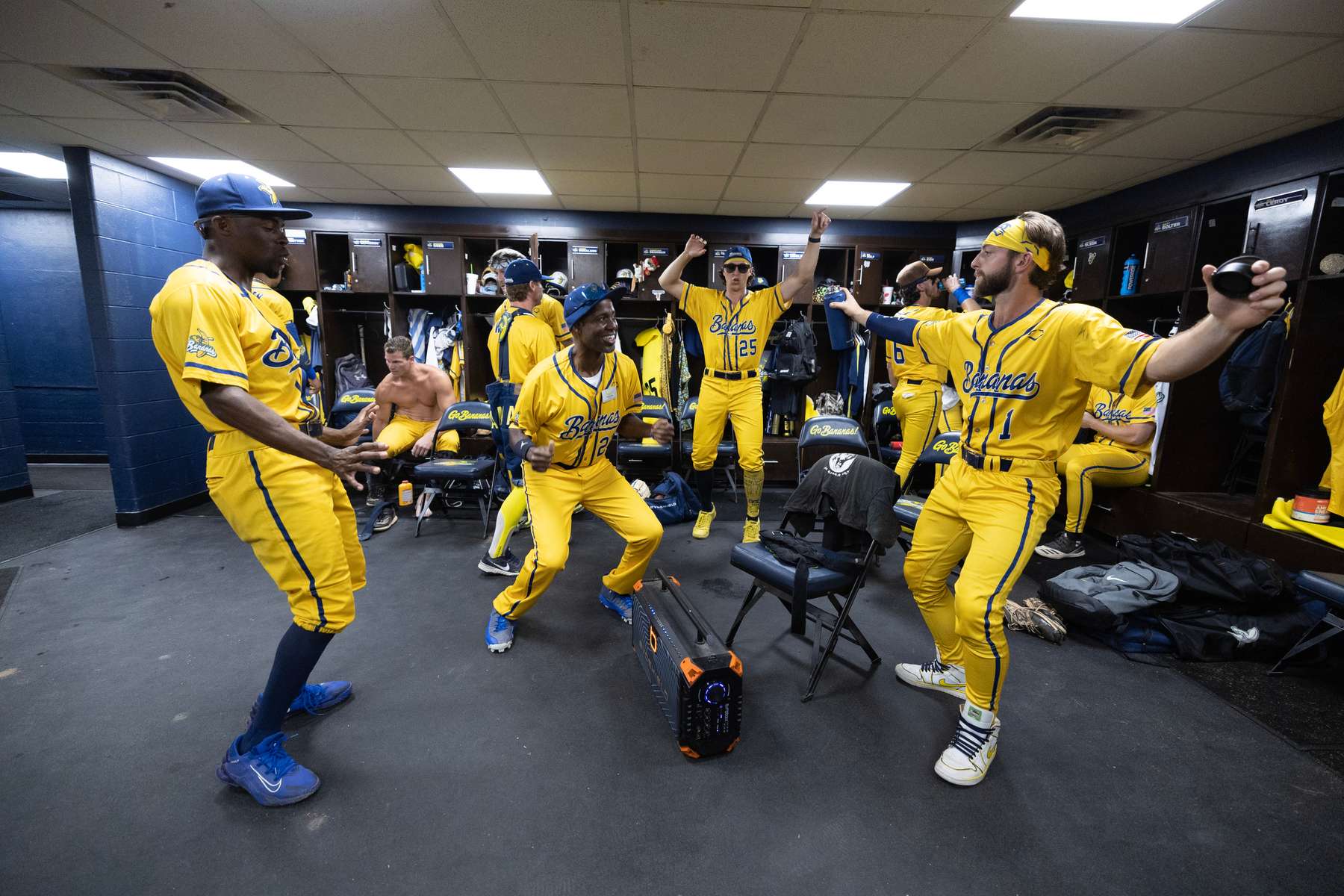 The Savannah Bananas dance in the locker room prior to their home opener against the Party Animals at Grayson Stadium on February 25, 2023 in Savannah, Georgia.   