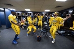 The Savannah Bananas dance in the locker room prior to their home opener against the Party Animals at Grayson Stadium on February 25, 2023 in Savannah, Georgia.   