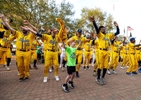 The Savannah Bananas dance with fans outside the stadium prior to their home opener against the Party Animals at Grayson Stadium on February 25, 2023 in Savannah, Georgia.   