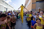 Dakota {quote}Stilts{quote} Albritton #14 of the Savannah Bananas greets fans before their game against the Staten Island Ferryhawks at Richmond County Bank Ball Park on August 11, 2023 in New York City.  