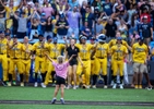 A young fan leads the Savannah Bananas and fans in a dance routine  before the game against the Party Animals at Richmond County Bank Ball Park on August 12, 2023 in New York City.  