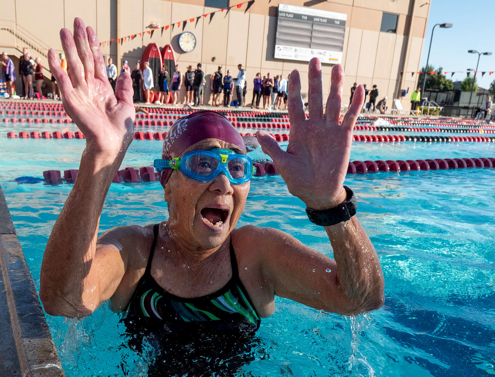 Senior athlete Flora Wong aged ninety one celebrates after completing the swim portion of the the Triathlon relay during the Huntsman World Senior Games on October 12, 2019 in St. George, Utah. 