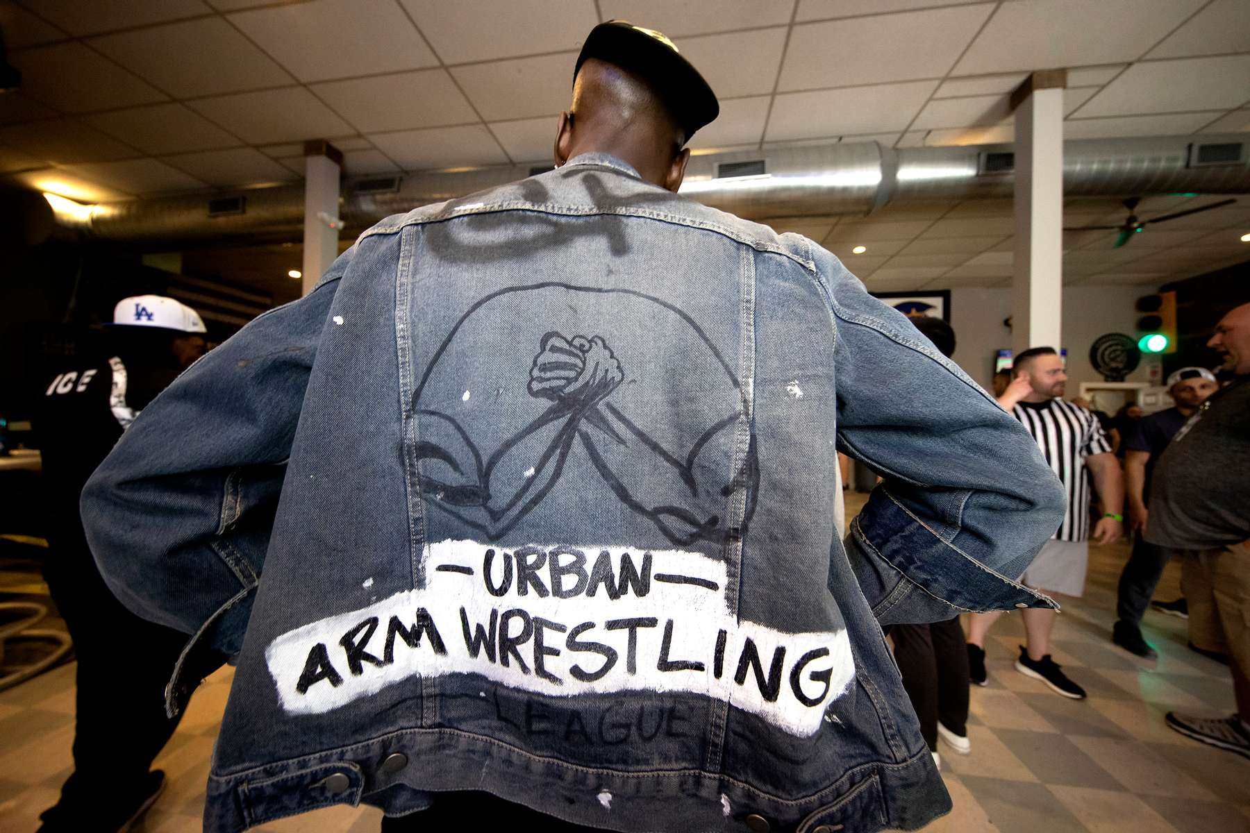 Gerren Nixon of the Urban Arm Wrestling League, displays his jacket  during the 98% Protest Series Arm Wrestling tournament on May 15, 2021 in Philadelphia Pennsylvania.  