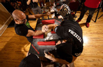  Lorenzo Montone (L) pulls against Ed Teixiera during the December Championships presented by the Urban Arm Wrestling League on December 12, 2021 in Wheatley Heights, New York.  