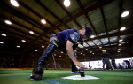 A student umpire wipes off home plate before calling balls and strikes in a simulated game while under the watch of an instructor who is playing the role of a team manager at the indoor batting cages during the Jim Evans Academy of Professional Umpiring on January 28, 2011 at the Houston Astros Spring Training Complex  in Kissimmee, Florida.  