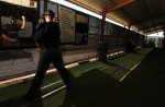 A student umpire works on his hand motion in the mirror before calling balls and strikes in a simulated game while under the watch of an instructor who is playing the role of a team manager at the indoor batting cages during the Jim Evans Academy of Professional Umpiring on January 27, 2011 at the Houston Astros Spring Training Complex  in Kissimmee, Florida.  