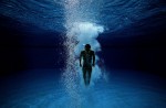 A diver swims to the surface during practise at the 15th Asian Games Doha 2006 at the Hamad Aquatic Centre on December 10, 2006 in Doha, Qatar.  