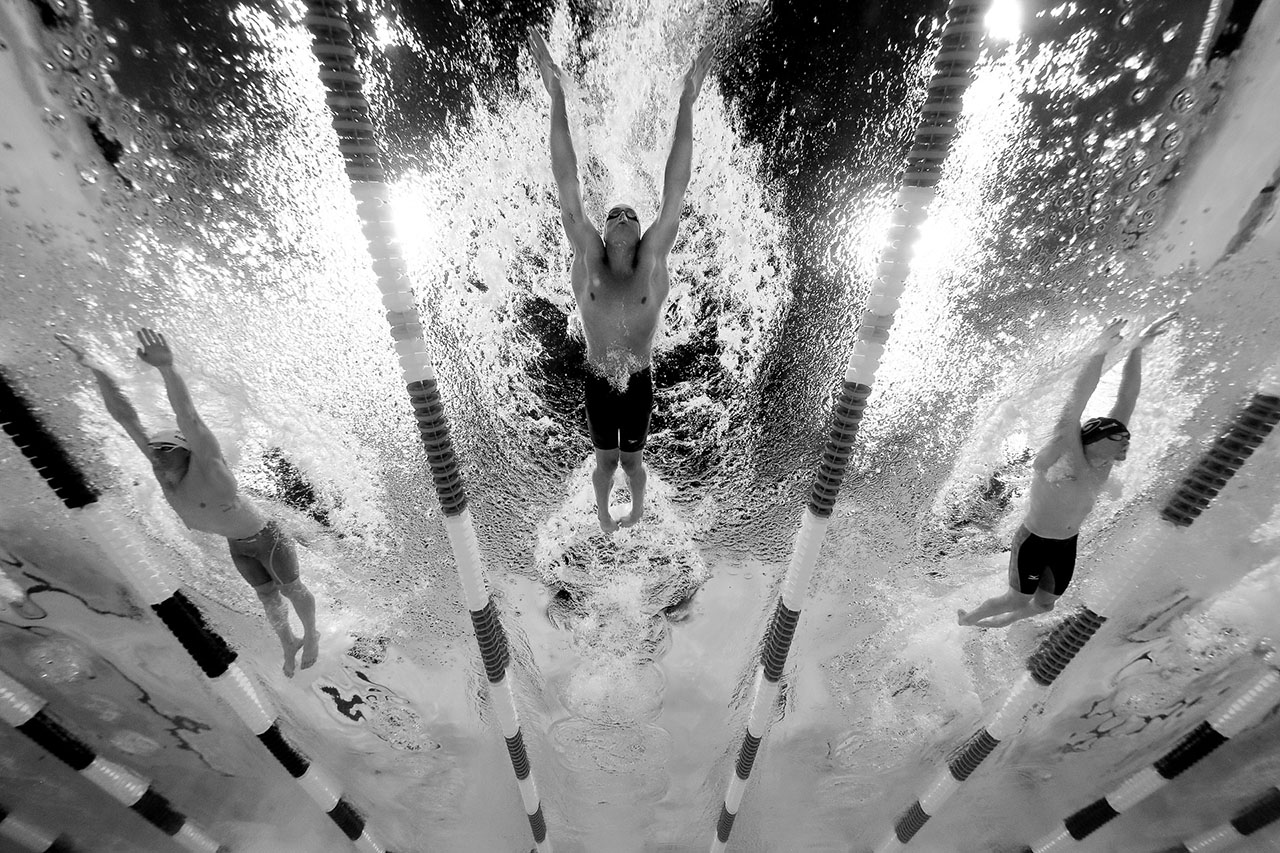 (L-R) Austin Surhoff, Ryan Lochte and Gunnar Bentz of the United States compete in a semi-final heat for the Men's 200 Meter Individual Medley during Day Five of the 2016 U.S. Olympic Team Swimming Trials at CenturyLink Center on June 30, 2016 in Omaha, Nebraska.