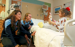 Professional Women's Soccer Player Nadia Nadim (L) , who was born in Kabul, Afghanistan visits 3 year old Valentina, with teammate and roommate Katy Freels,  at Jersey Shore Medical Center in Neptune, NJ.  