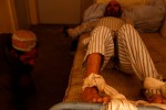 A man is tied down to a bed in the hallway of the men’s psychiatric ward.  This is the sole government-run hospital of its kind, equipped with only 60 beds in total.