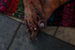 Some of the homeless persons wear sandals, but others walk around barefoot. 