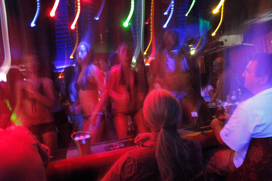 Many foreign men gather at the night clubs which are filled with young girls in Angeles City, Philippines.