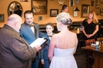 Megan and William Elope in Burlington Vermont, with their sun Chase. They held their ceremony in the fireside lounge at The Farmhouse Tap and Grill in Burlington, VT.