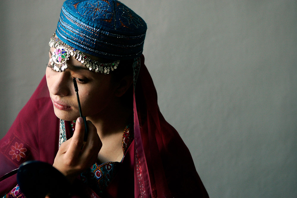 Afghan Actress, Marina Golbahari, was the leading star in the film Osama, released in 2003. In the movie she plays a girl who is forced to disguise herself as a boy in order to work during the Taliban era. In real life Marina worked as a street beggar before becoming an actress. She applies her make up backstage before a performance of Shakespeare in Kabul. 