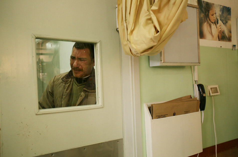 Khalid Akram al Kolak cries as he looks through the window of the ICU. His daughter, Aya al Quolak, was in need of urgent surgery at the Soroka Hospital in Israel. It took 4 days to get clearance from the IDF for her to travel. She was then transfered into Israeli custody after  crossing Erez. Her parents were not allowed to travlel with the toddler. 