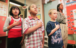 Students in Laneka Reeves' second grade class recite the Pledge of Allegiance at the Mary K. Lang Elementary School in Kennett Square, PA. 