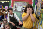 Kindergarten student Marisa Woodward reacts to a question on the days of the month posed by teacher Laurie Crestani at the Kindergarten Academy in Prospect Park, PA.
