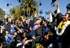 Jubilant students throw their caps into the air at their graduation ceremony at Soka University in Aliso Viejo, Ca.