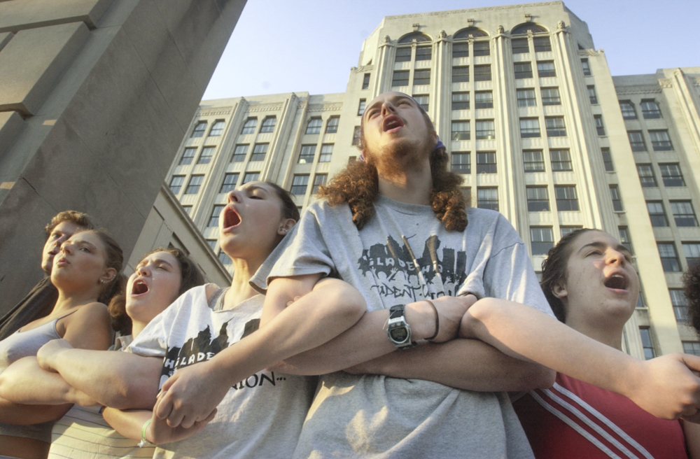 Students, mostly from the Philadelphia School District surround the school district's administration building. The student protesters prevented district employees from entering the building. It also forced the relocation of the School Reform Commission’s announcement of which schools would be assigned to private for-profit companies. From right are Sonya Isard a Girl's High student, Andrew Esslerhaines, a Philadelphia resident who goes to Upatina's School in Chester County, Leah Bender Siemiaroski, a Girl's High student, and Abigail Ellmand, Dyani Makous, and Kenneth Ballard, all students at Central High School.