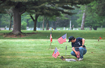 On Memorial Day, at the Lawn Croft Cemetery in Delaware County,  Ed McKay carries on the annual tradition of placing flags on the graves of deceased Wade dump firefighters.