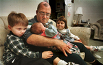 Donald Tees, a paramedic at the fire, was diagnosed with brain cancer in 1988. With him in February of 1998 at his Chester home were his children (from left) Donald, 5, Edna, 9 weeks, and Becke, 4. Tees died of brain cancer in 2010.