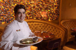 Iron Chef Jose Garces with the snapper at El Vez