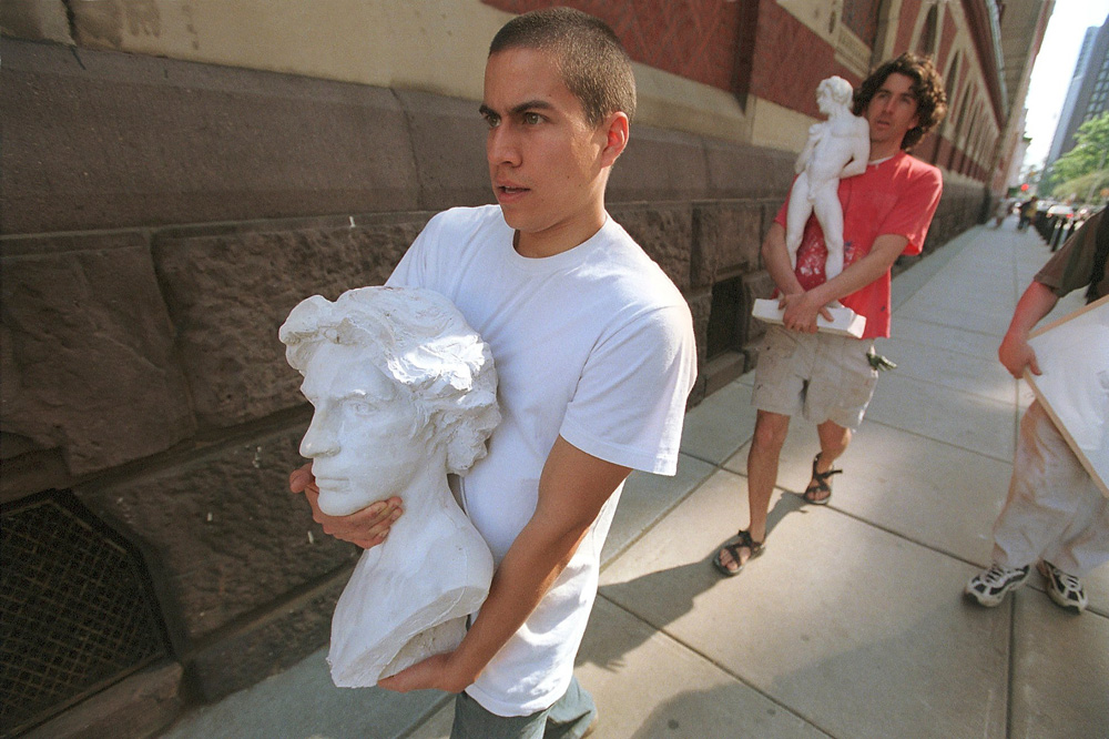 Mark Utreras, left, carries bust, which is a self-portrait b.y fellow student Joshua Koffman, right, at the Pennsylvania Academy of Fine Arts in Philadelphia,  PA. Both were preparing for showing their artwork at the academy's  the annual exhibition of student  exhibtion