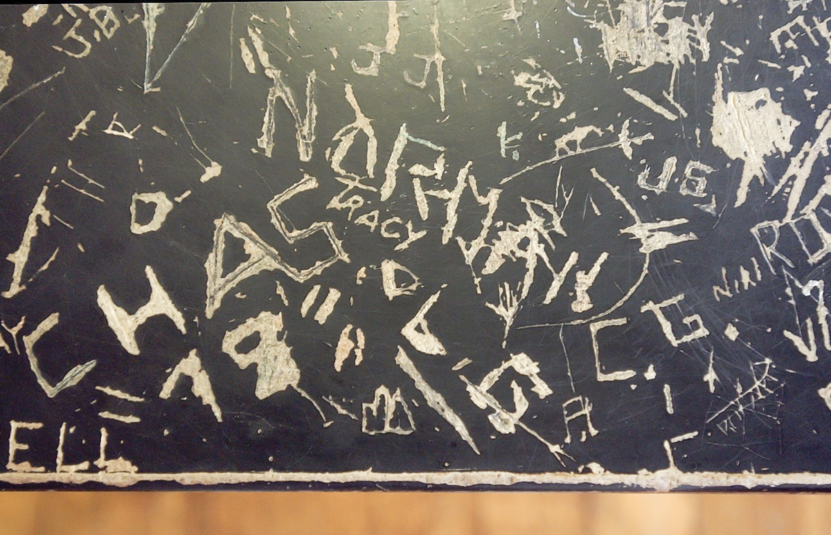 A good part of Diaz' first morning setting up his class was devoted to cleaning and repairing his classroom's lab tables which suffered from years of graffiti and loose legs which needed to be tightened.