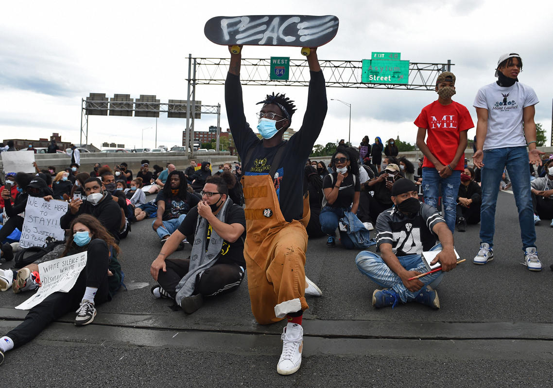 Hartford, CT - 6/1/20 - David Walker, of Hartford, and other protesters block Route I-84 Monday evening demanding action against police violence against people of color. Photo by Brad Horrigan | bhorrigan@courant.com