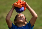 Second grader Leah Costa cools down in the {quote}wet seat{quote} during Fun Day at Brooklyn Elementary School. 