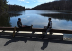 Two friends social distance at the West Hartford reservoir Wednesday afternoon. Both are residents of West Hartford. 