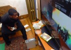 Ismail Abdussabur plays his xbox360 at his New Haven home. 