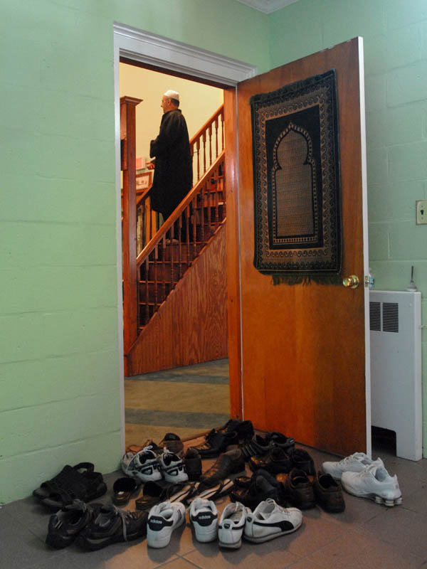 Interim imam Mehmet Celebi leads prayer at the Mevlana Mosque on Ocean Avenue in West Haven.   The mosque opened at the site of the old St. John's By the Sea Episcopal Church.  