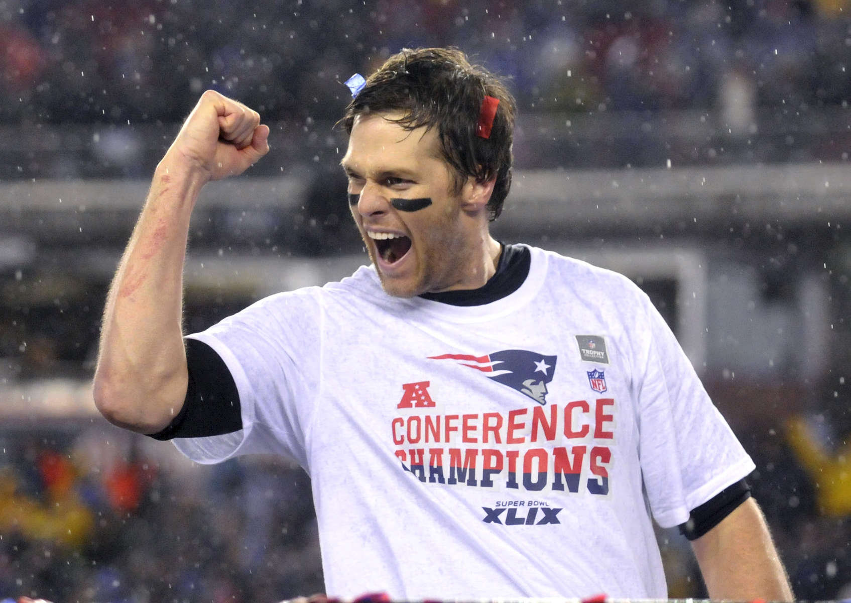 New England Patriots quarterback Tom Brady celebrates an AFC Championship victory over the Indianapolis Colts in the game that would be known for {quote}Deflate Gate.{quote}