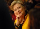 Hillary Clinton smiles at a friend who speaks up on her behalf at a round-table discussion in New Haven.