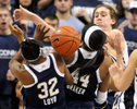 Notre Dame players Jewell Loyd and Ariel Braker battle UConn's Breanna Stewart for a loose ball at Gampel Pavilion.