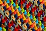 Rows of colorful crayons on an assembly line at Crayola