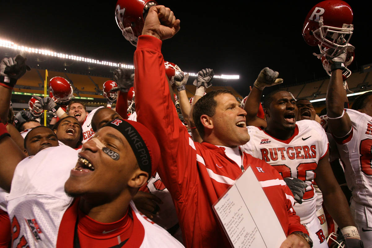 Rutgers head coach Greg Schiano joins his players to celebrate their victory over Pitt as the Scarlet Knights played the University of Pittsburgh Panthers at Heinz Field in Pittsburgh, Pennsylvania.
