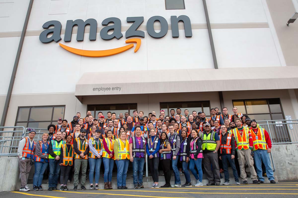 Group photo of culturally and racially diverse Management Team standing outside the Amazon Fulfillment Center in Edison, NJ on 12/12/18.  