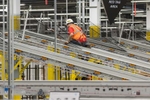 Workman working on conveyor system at the new Amazon Fulfillment Center, in West Deptford, NJ on 8/17/18. 